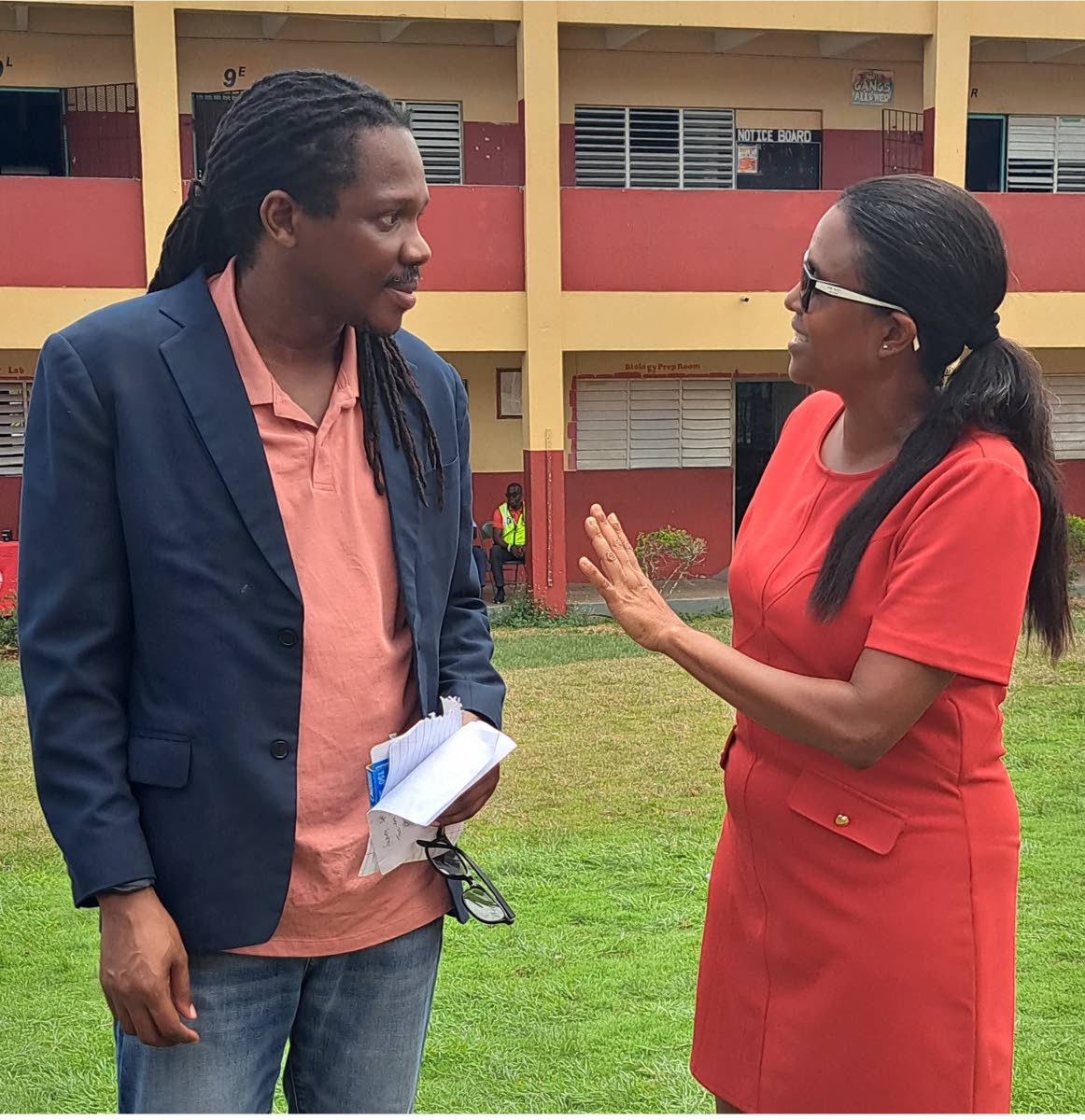 St Catherine North Western Member of Parliament Damion Crawford (left) in conversation with Trisha Williams-Singh, chairperson of the Early Childhood Commission, at the recently held certification fair.