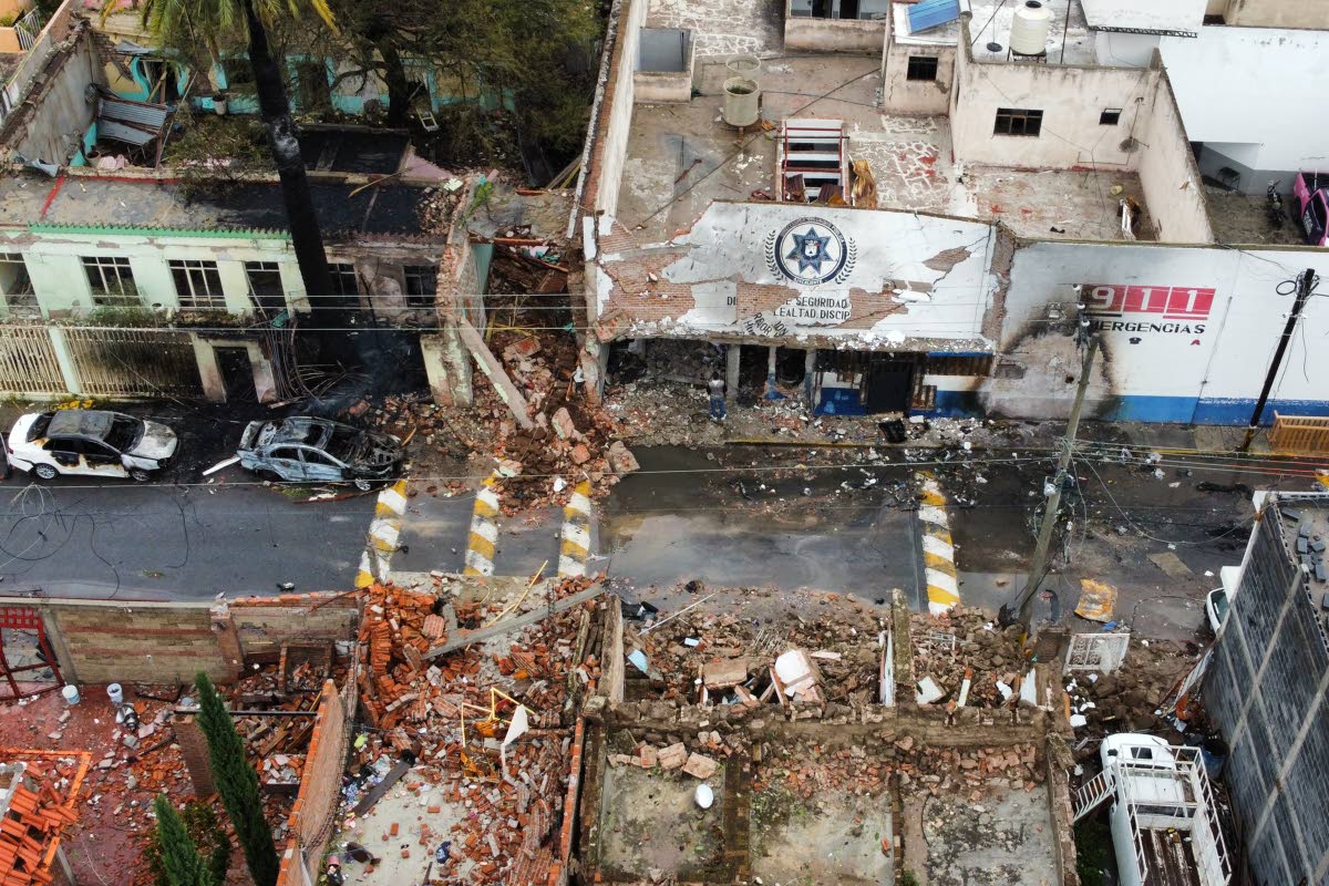 A municipal police station (top) and other buildings are damaged after a car bomb exploded the previous night in Ojocaliente, Zacatecas state, Mexico, last Monday.