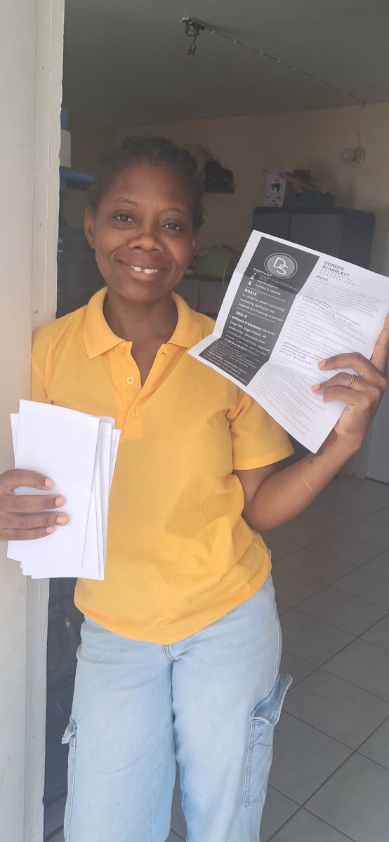 Doreen Lillian Scarlett with copies of her résumé. 