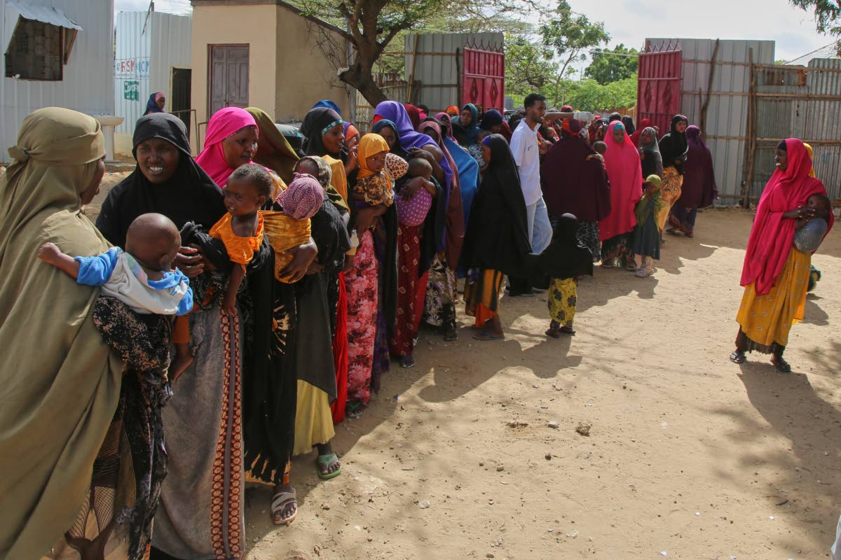 Women displaced by drought line up at Feynuus Nutrition Centre on the outskirts of the capital, Mogadishu, Somalia.