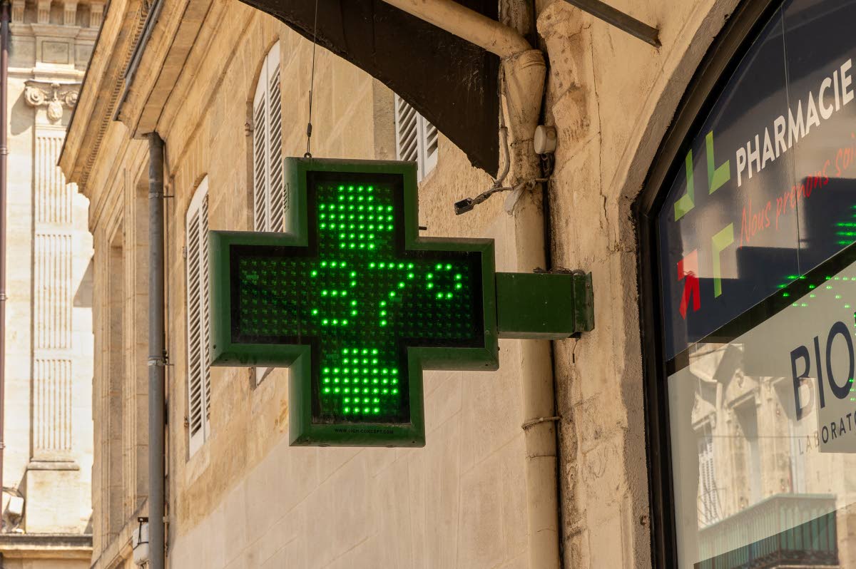 A pharmacy sign displays a temperature of 37 degrees Celsius (98.6 degrees Fahrenheit) in Bordeaux, France, as a heatwave affects much of the country.