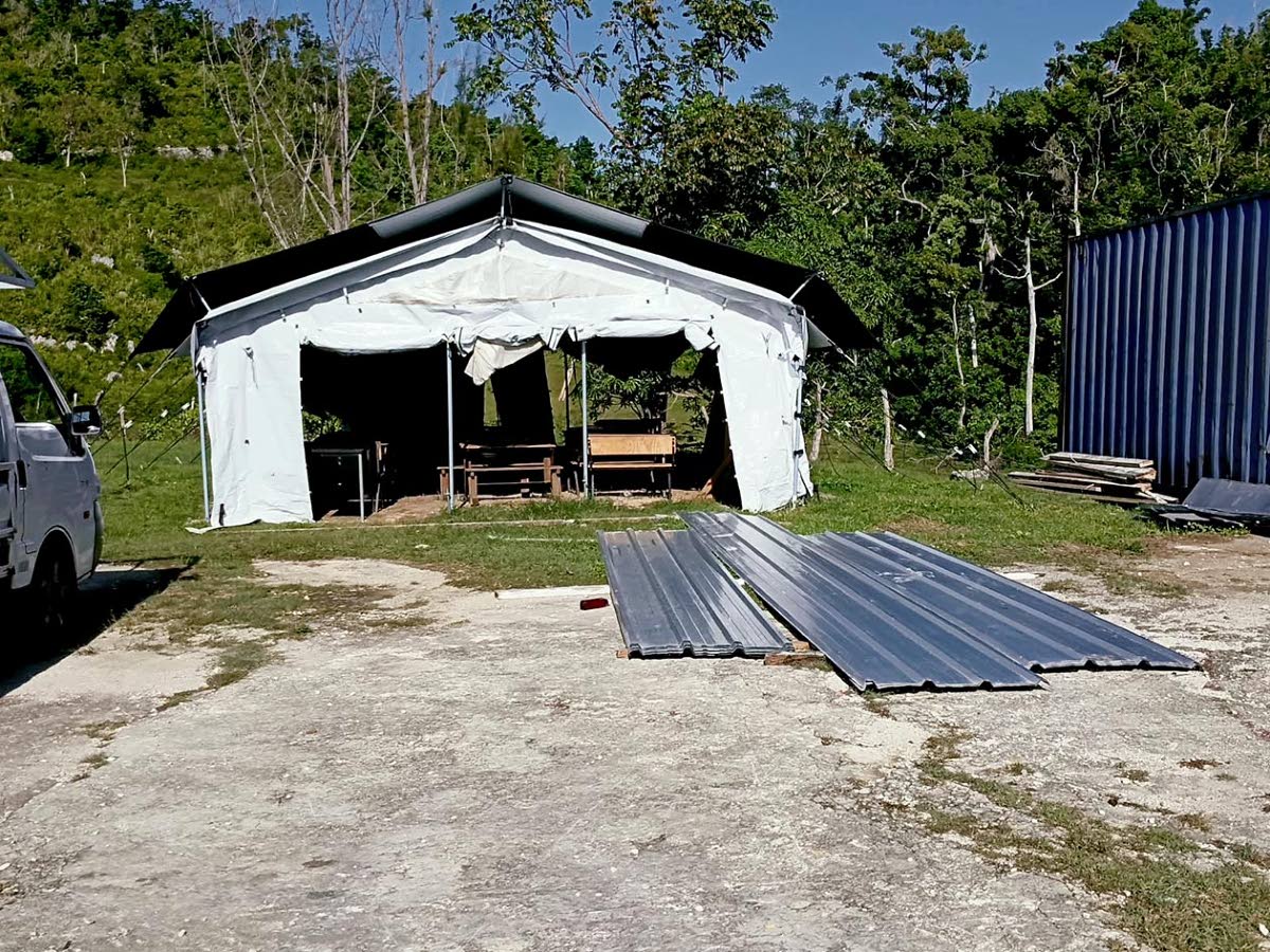 Sheets of zinc lay on the grounds of Carisbrook Primary and Infant School as repair work continues.  