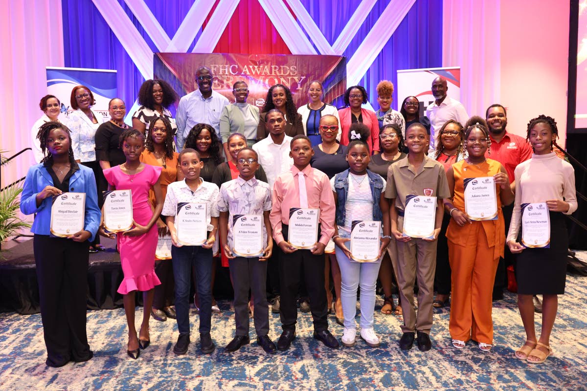  PEP and tertiary awardees proudly celebrate their achievements alongside members of the FHCCU team, FHCCU Board and FHCCU Foundation Board following the presentation of scholarships at the FHCCU Awards Ceremony. 