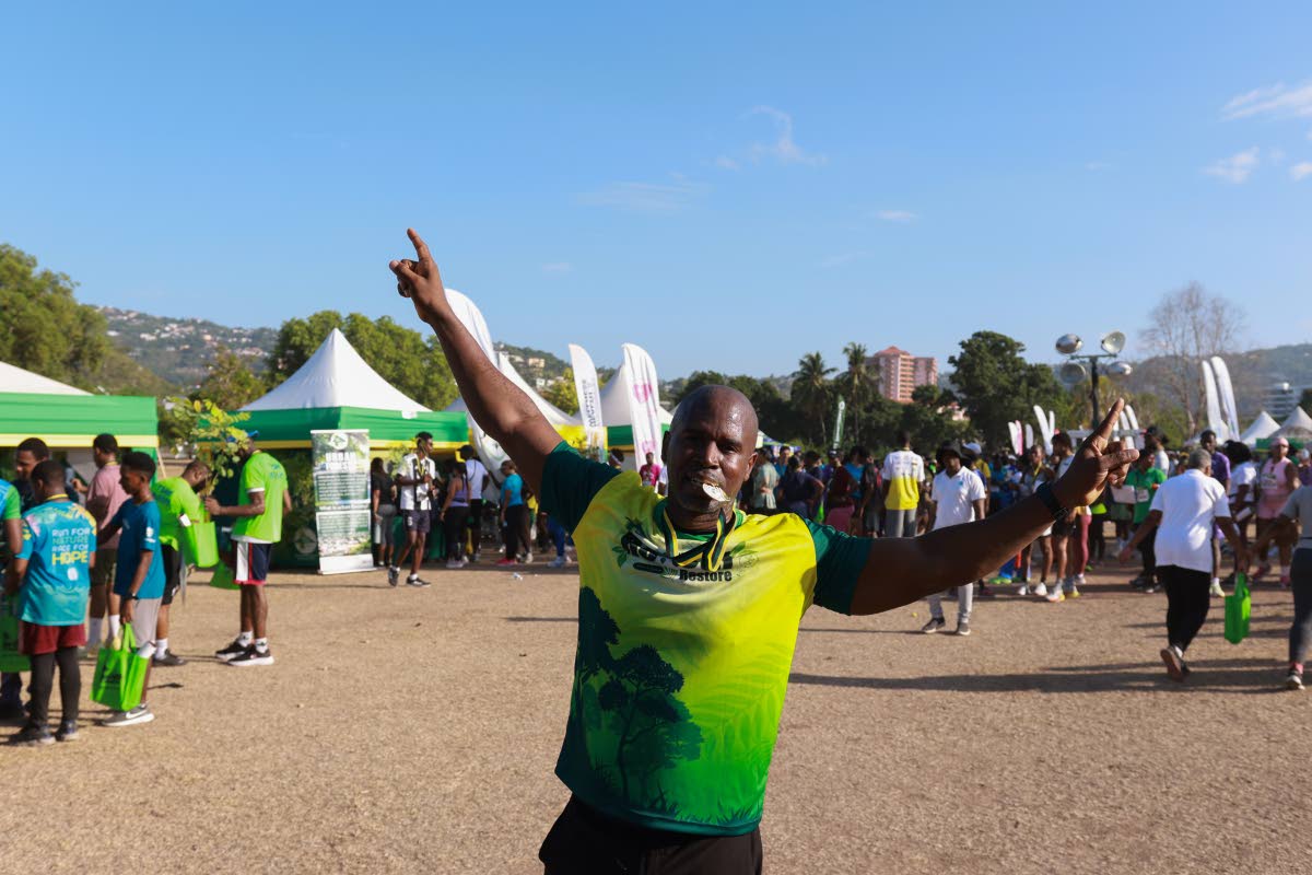 Stokely Rose, founder of TrainFit Club and race patron for the 5K Urban Forest Run 2026, celebrates after completing the race last August.