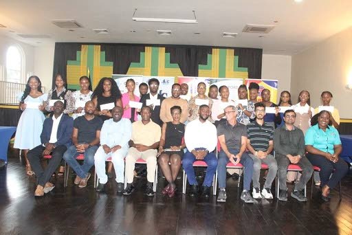 Mayor of Montego Bay Richard Vernon (fifth from right) shares the handover ceremony with councillors from the St James Municipal Corporation, members of the business community who sponsored the Mayor’s Charity Fund, and the 23 scholarship recipients.