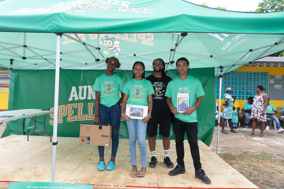 Aunt Lize Spelling Bee founder Kurtious Loney-Walsh (second right) shares a post-win portrait with high-school category winners (from left) Tanique Thompson, who placed first; Alyssa Hoilett, second; and Duvair Taylor, third.