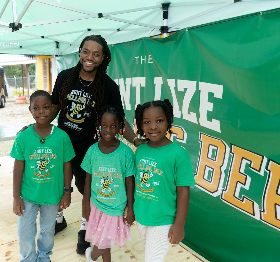 In between the day’s spell-off rounds, organiser Kurtious Loney-Walsh joins competition entrants (from left) eight-year-old Kassondre Walker, six-year-old Aria Gilmore and seven-year-old Kaliyah Vassell for a snapshot.