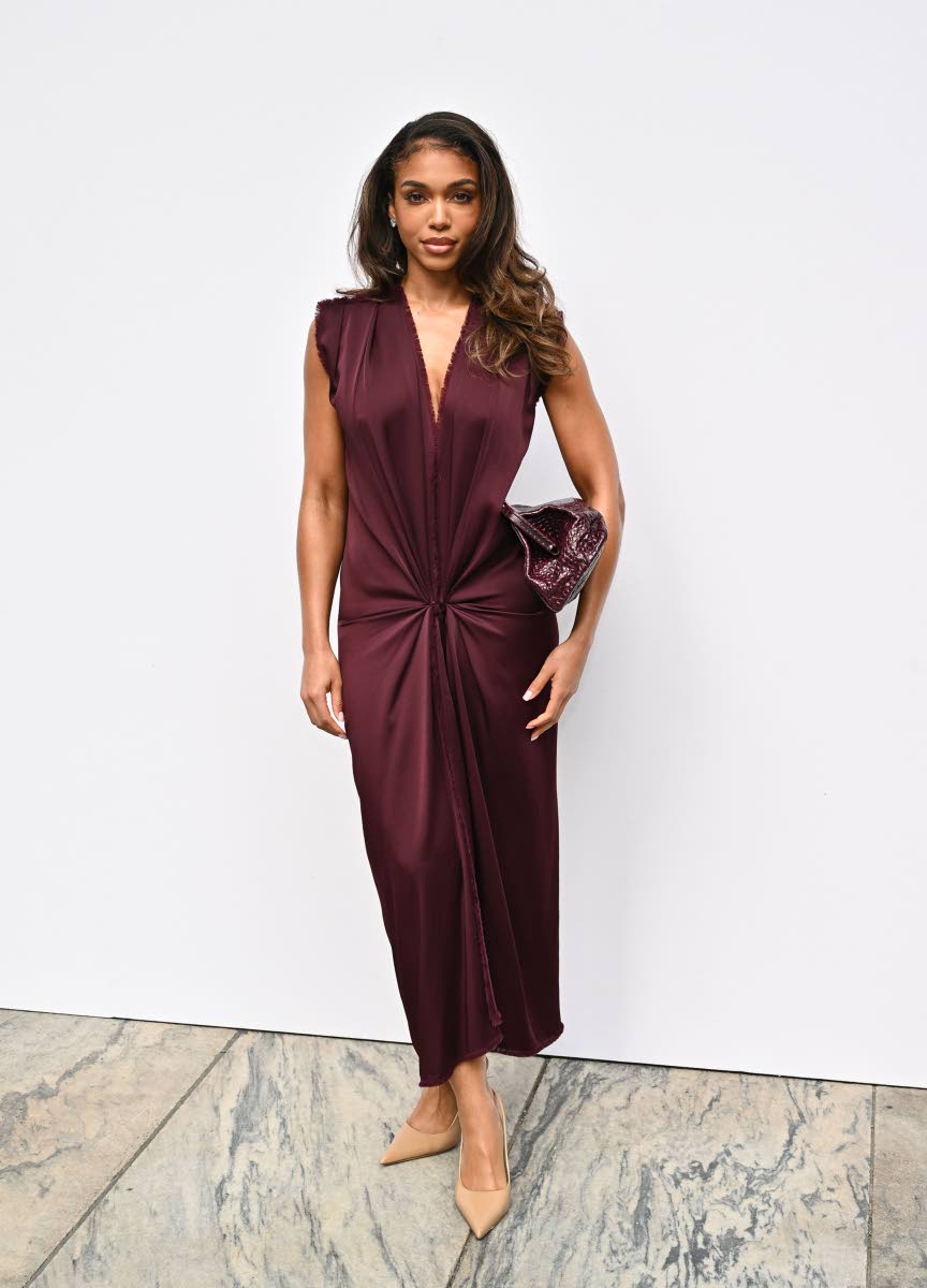 Lori Harvey makes a polished case for plum at Michael Kors.
