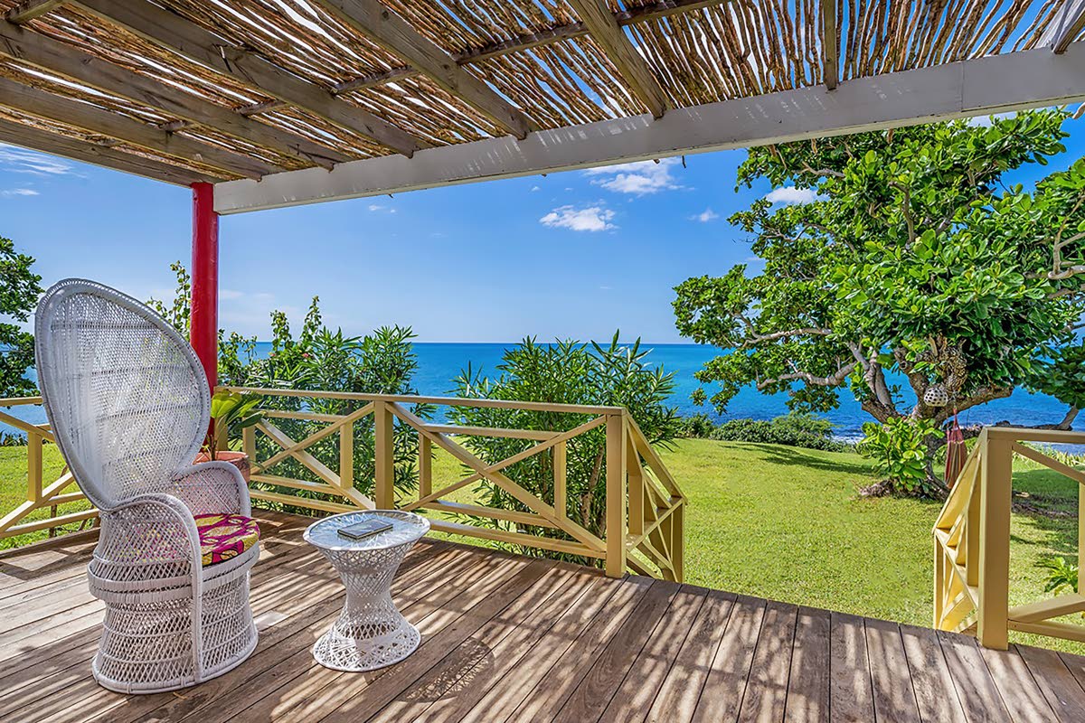 A rustic porch gives a view of the sea in all its glory. 