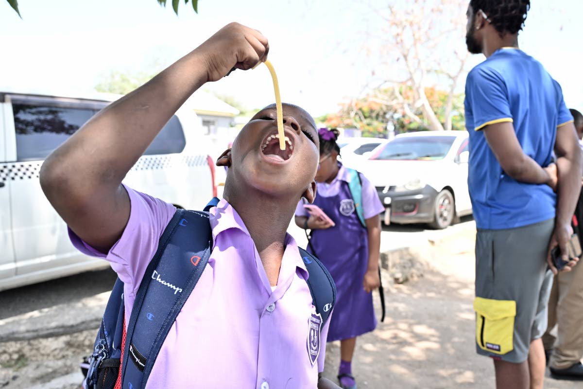 A student having a snack at Ascot Primary School in Portmore. 