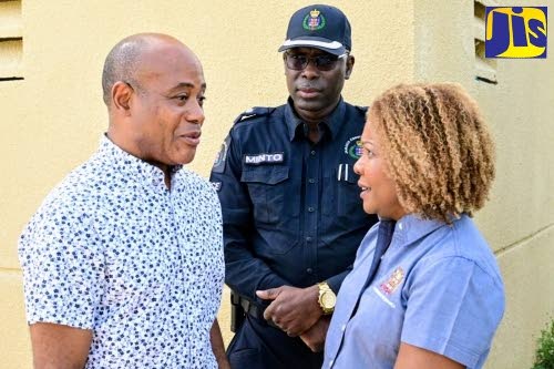Minister of Education, Skills, Youth and Information, Senator Dr Dana Morris Dixon (right) in conversation with Head, Department of Anaesthesia and Intensive Care, University Hospital of the West Indies (UHWI), Dr Kelvin Metalor (left) during a visit to th