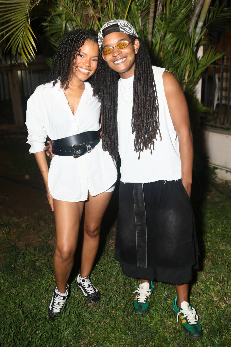 Grammy-winning artiste Koffee (right) and attorney-at-law Kristina Graham pause for a warm snap.