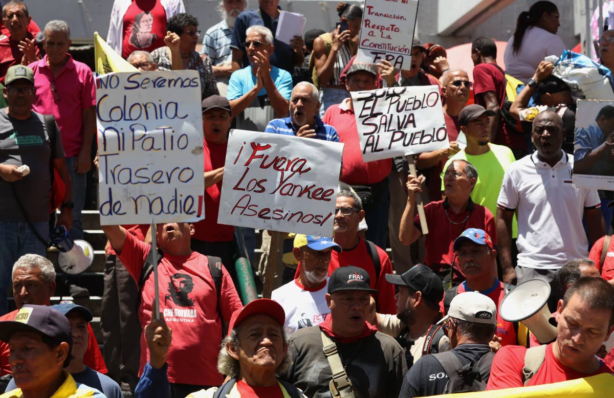 Venezuelans protest in Caracas against President Donald Trump’s deal, giving the United States a stake in Venezuela’s oil reserves on Saturday, August 29.