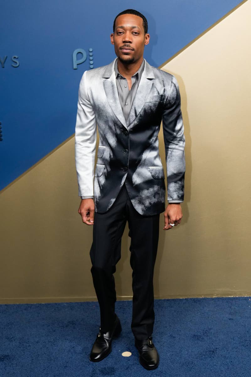 Tyler James Williams keeps his Emmy look sharp and sophisticated in Givenchy. 