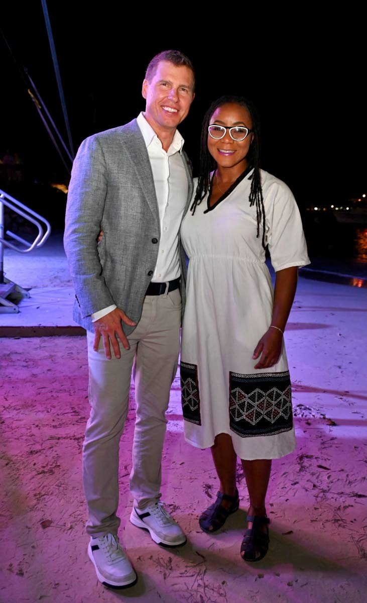 Adam Stewart, executive chairman of Sandals Resorts International, and Tova Hamilton, minister of state in the Ministry of Tourism, pause for a photo.