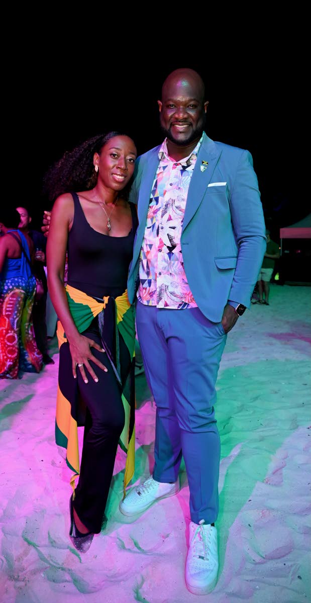 Veta Ann Patten of Veta Designs LLC pairs up with O’Brian Heron, president of the Jamaica Hotel and Tourist Association, for a quick snap.
