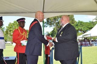 Governor General Sir Patrick Allen with Philip Mascoll being invested with the Order of Distinction, Officer Class, October 20, 2013. Mascoll also received the Governor General’s Diaspora Award on June 17, 2008.