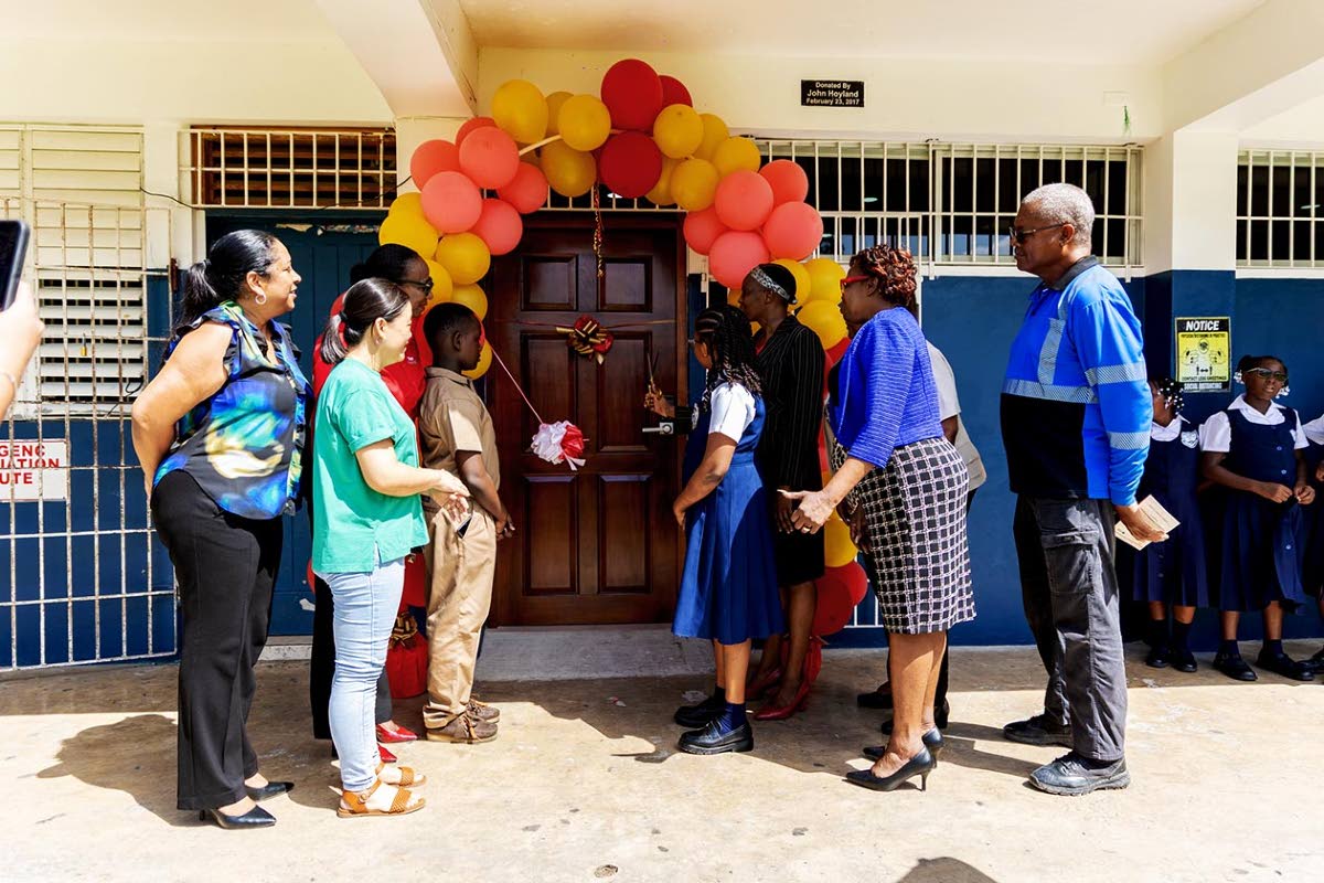 Representatives of the Digicel Foundation, Anchovy Primary School, the Ministry of Education, Skills, Youth and Information Region Four, and the Anchovy business community gather for the ribbon-cutting ceremony marking the reopening of the school’s smart
