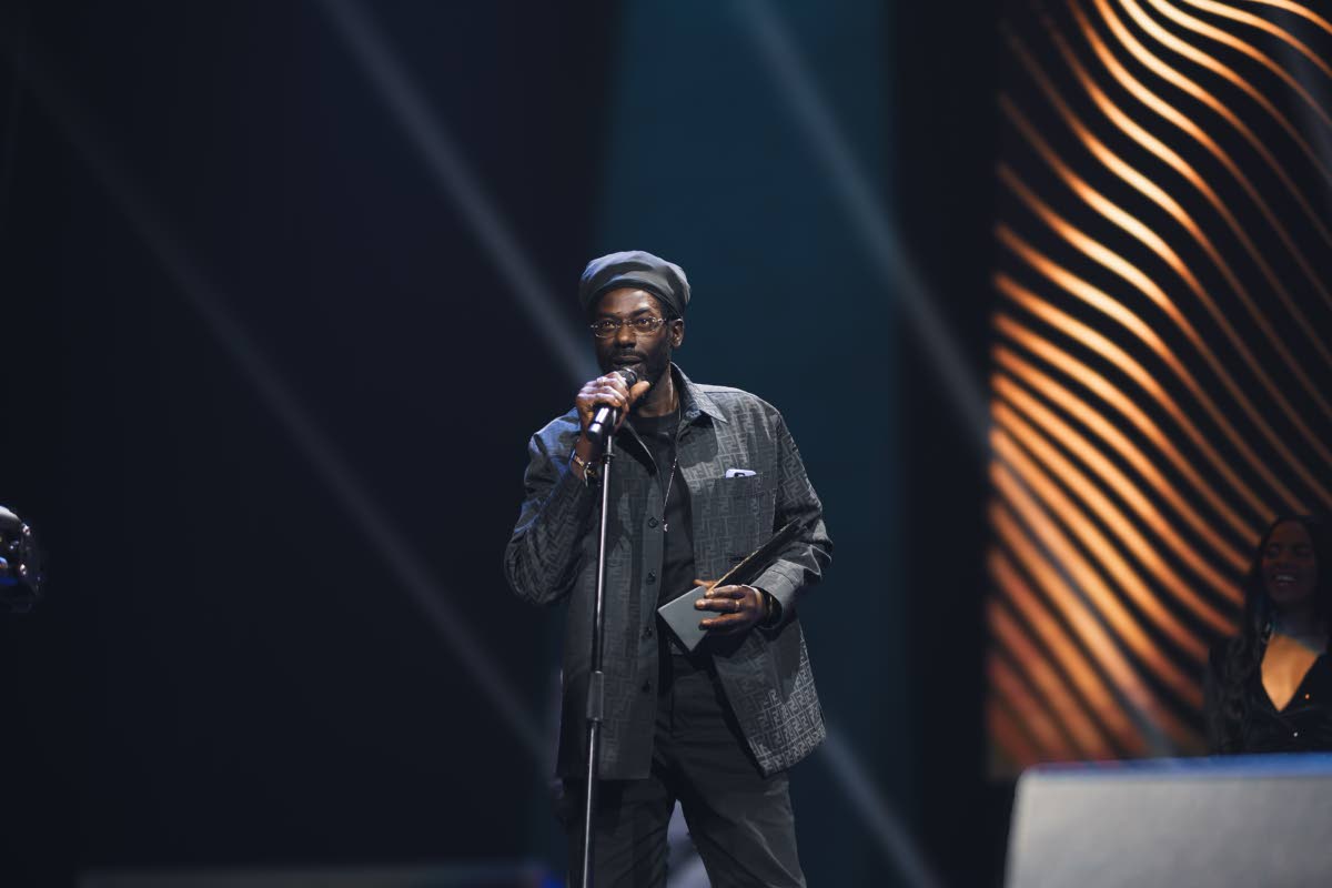 Buju Banton collects the Reggae Collaboration of the Year award on behalf of himself, Bugle and Damian Marley at last year’s Caribbean Music Awards.