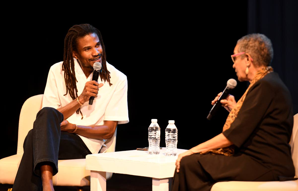 Sheldon Shepherd (left) shares the stage with veteran broadcaster Fae Ellington during a conversation following the listening event for his debut album, ‘Give Thanks’.