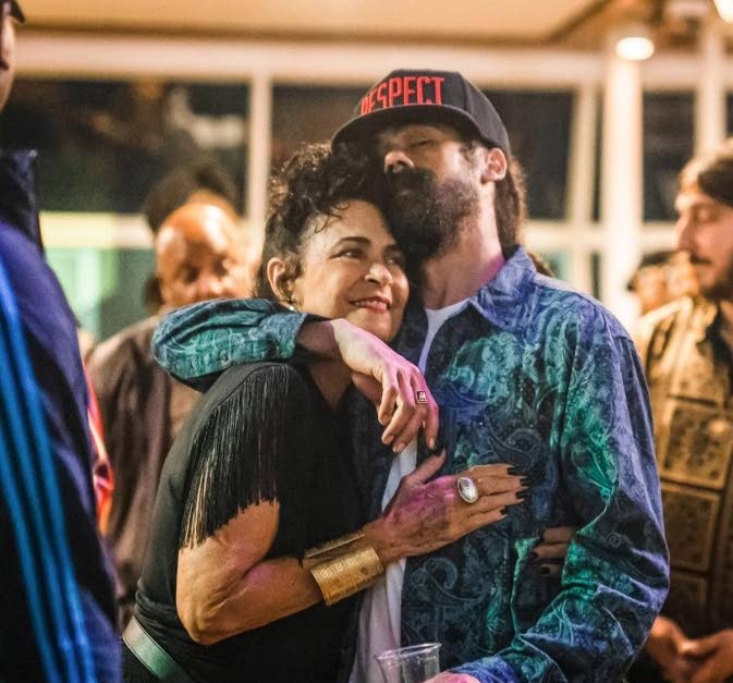  Damian ‘Jr Gong’ Marley lovingly embraces his mother, Cindy Breakspeare.