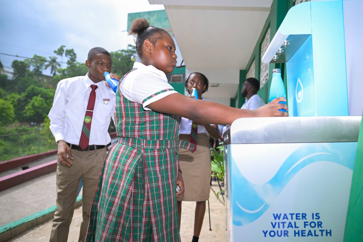Students of Oberlin High School in St Andrew enjoy chilled, purified water from the institution’s newly installed hydration station, donated by Newport Water Limited, during a handover ceremony on September 18.