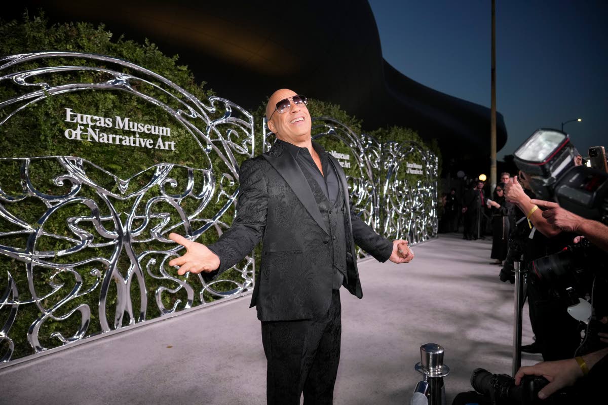 Above: A jovial Vin Diesel welcomes the cameras with open arms.