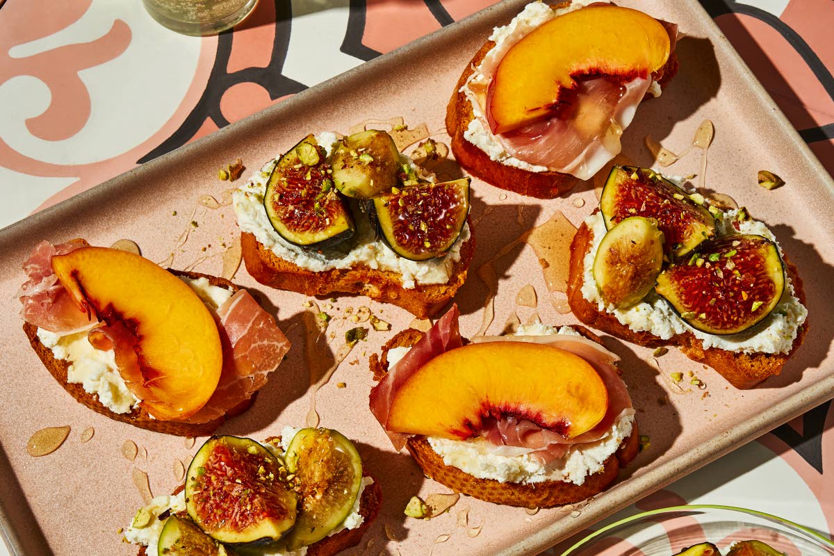 Crostini with seasonal fruit, ricotta, and honey from the cookbook ‘Stuzzichini’ by Stef Ferrari.