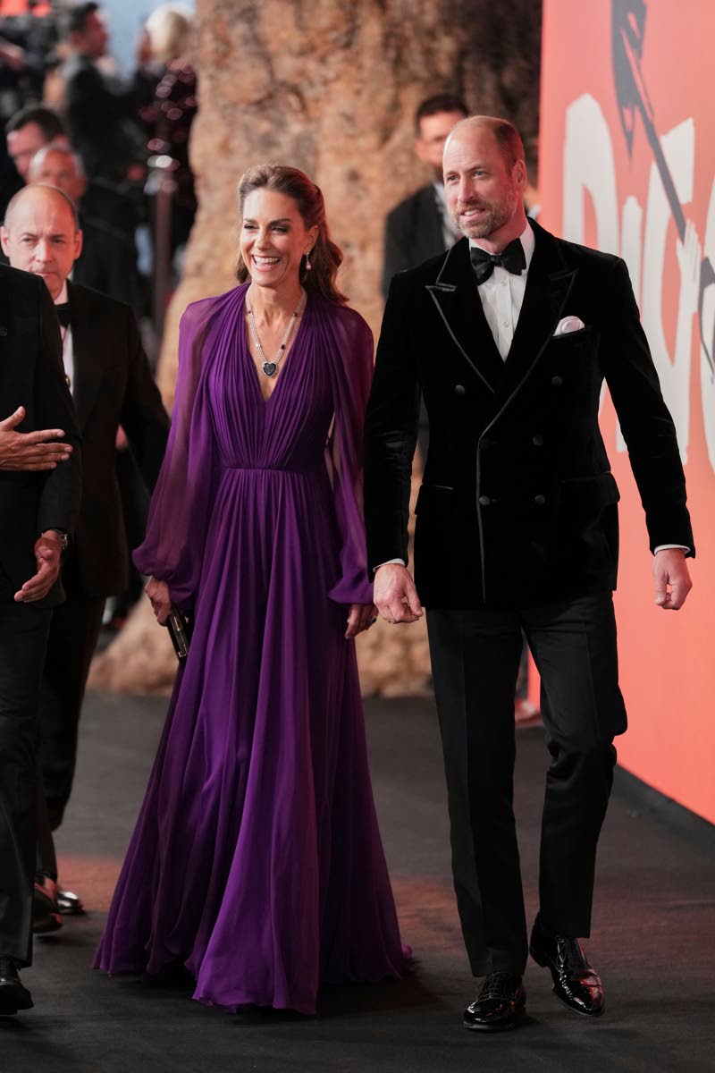 Britain’s Kate, Princess of Wales (left), in Jenny Packham with the Queen Mother’s Amethyst Sautoir necklace, and Britain’s Prince William arrive at the world premiere of ‘Digger’ in London on Tuesday.