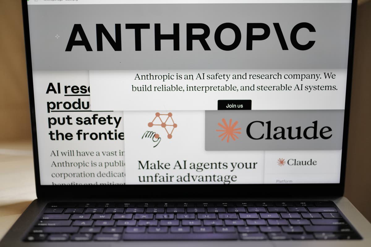 Pages from the Anthropic website and the company’s logos are displayed on a computer screen in New York on February 26, 2026.