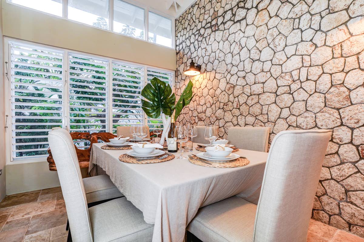 The dining room with its grand cutstone feature wall. 