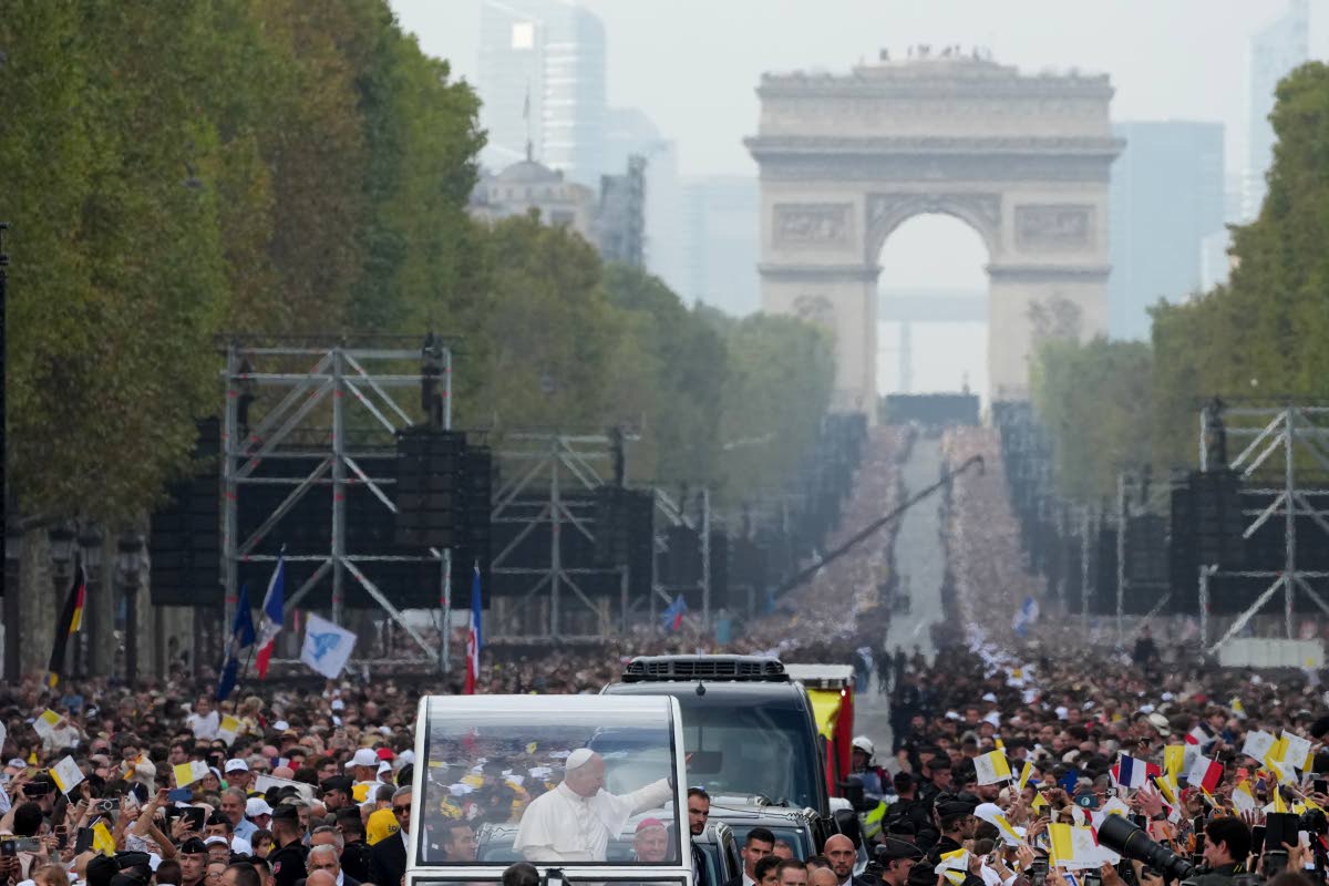 Pope Leo XIV greets faithful as he arrives to celebrate mass at Place de la Concorde, Paris on  Saturday.