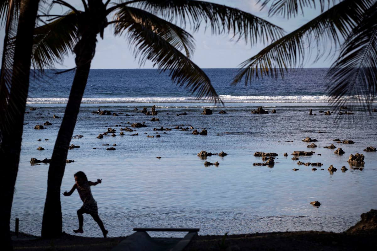 A child plays near the beach in Nauru during the Pacific Islands Forum on the Pacific nation of Nauru.