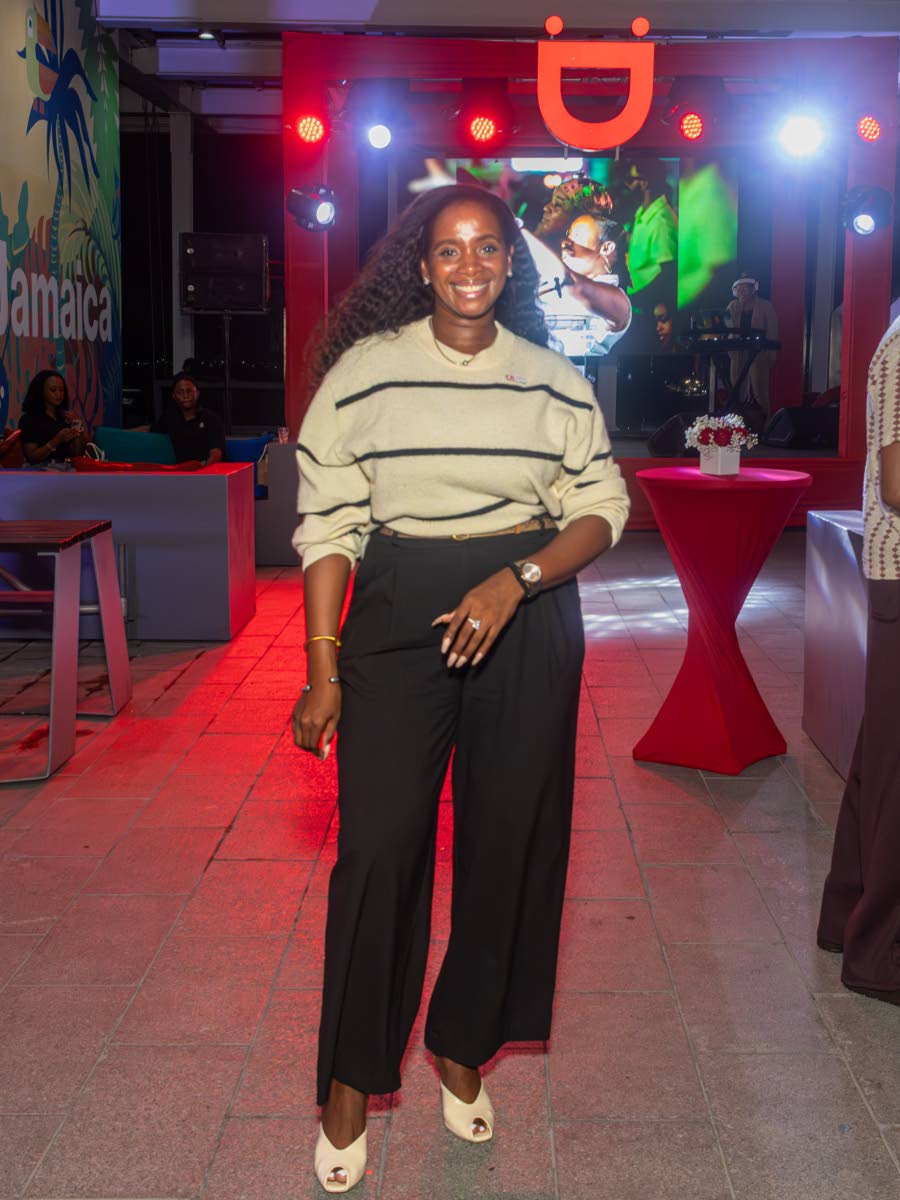 Digicel Business Solutions General Manager Tashima Walker is all smiles in peep-toe pumps, a cosy sweater and trousers.
