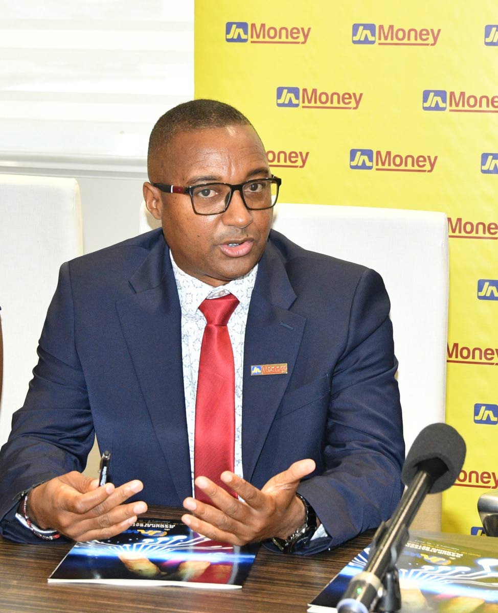 Horace Hines, general manager of JN Money Services, speaking on the JN Money App at the JN Group Corporate Office in New Kingston, Jamaica recently.
