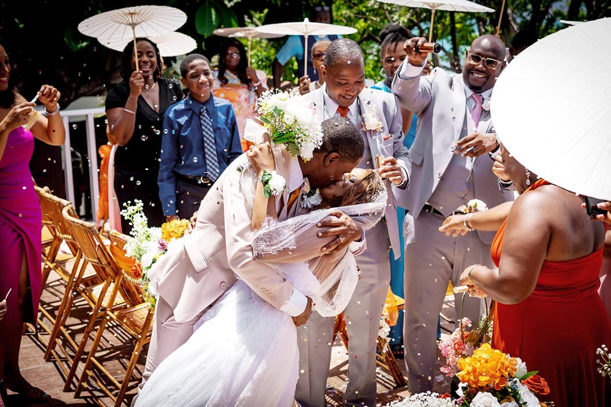 Arthur dips Camille for a kiss moments after they are declared husband and wife.