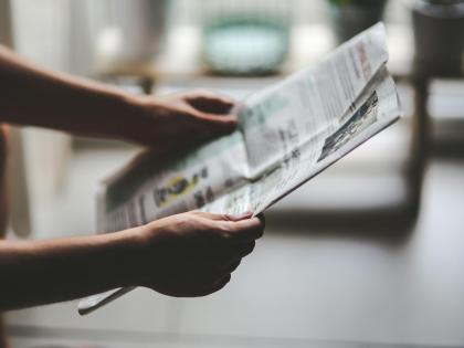 Person reading paper