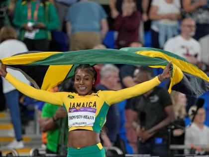 Elaine Thompson-Herah celebrates after winning the gold medal in the women’s 100m final during the athletics in the Alexander Stadium at the Commonwealth Games in Birmingham, England, in August 2022.