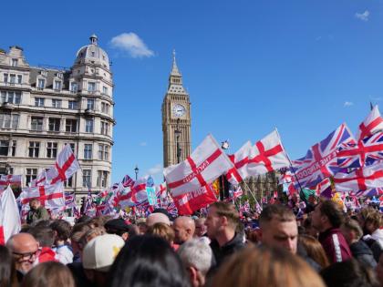 People demonstrate during the Tommy Robinson-led Unite the Kingdom march and rally, in London on Saturday.