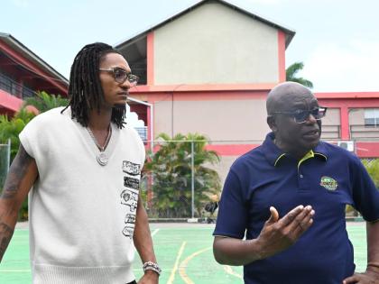 
San Antonio Spurs Devin Vassell (left) and JaBA President Paulton Gordon.