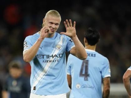 Manchester City’s Erling Haaland celebrates after scoring the opening goal during the Champions League opening phase match between Manchester City and Napoli at the Etihad Stadium in Manchester, England, yesterday. Manchester City won 2-0.