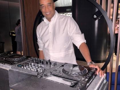 Cool, collected, and always ready to turn up the vibes, Miami-based DJ Timmy HMV smiles for the camera. 