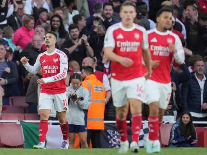 Arsenal's Gabriel Martinelli reacts after scoring during the Premier League football match between Arsenal and Manchester City in London, Sunday, September 21, 2025. (AP Photo/Kin Cheung)