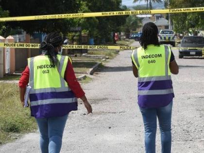 INDECOM investigators at a scene. - File photo.