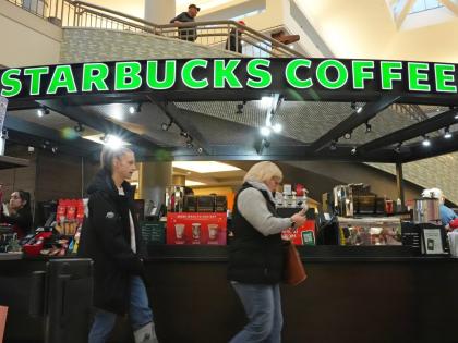 Shoppers at the Walden Galleria in Buffalo, NY, stop by the Starbucks kiosk on Saturday, November 30, 2024. (AP Photo/Gene J. Puskar, File)