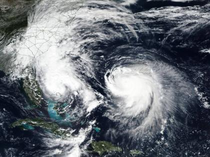 This Monday, September 29, 2025, satellite image released by NASA shows Imelda, left, and Hurricane Humberto in the Atlantic Ocean. (NASA Worldview, Earth Observing System Data and Information System (EOSDIS) via AP)