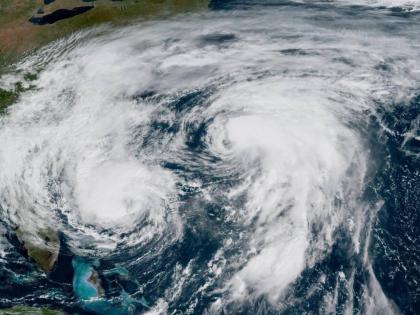 This GOES-19 GeoColor satellite image taken Tuesday, September 30, 2025 and provided by NOAA, shows weather systems in the Atlantic Ocean, Hurricane Imelda, left, and Hurricane Humberto at right. (NOAA via AP)