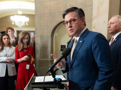 House Speaker Mike Johnson (front), with House Majority Leader Steve Scalise (right), speaks during a news conference at the Capitol in Washington yesterday.