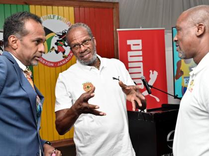 
Alfred ‘Frano’ Francis (centre), race director of Reggae Marathon, in conversation  with Dr Carey Wallace (left), executive director of Tourism Enhancement Fund, and Ian Kelly, chairman of Reggae Marathon, at the 2025 Reggae Half Marathon, 10K and 5K 