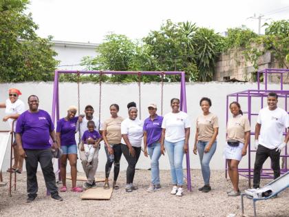 As part of Bogle’s Property Services’ fifth anniversary celebration, the company donated a refurbished playground to Annie Dawson Home for Children. Here, founders Nicholas Bogle (fourth left) and his wife, Tamara Grant-Bogle (third left), are joined b